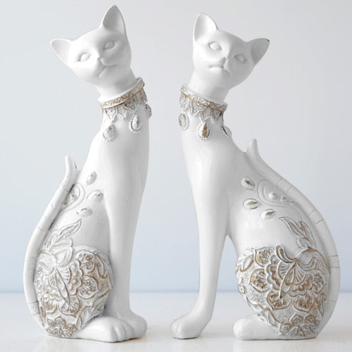 White and Blue Cat Figurines