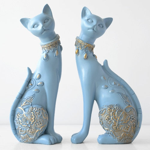 White and Blue Cat Figurines