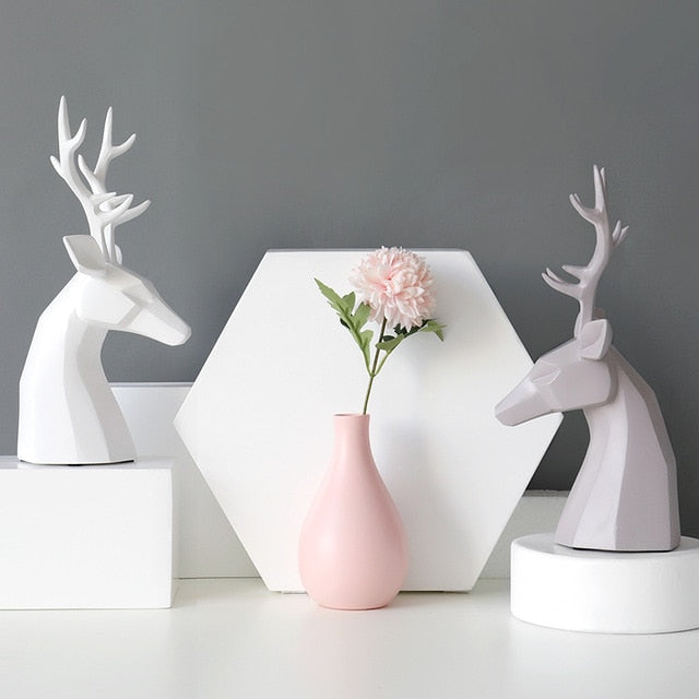 Two deer figurine tabletop and a vase